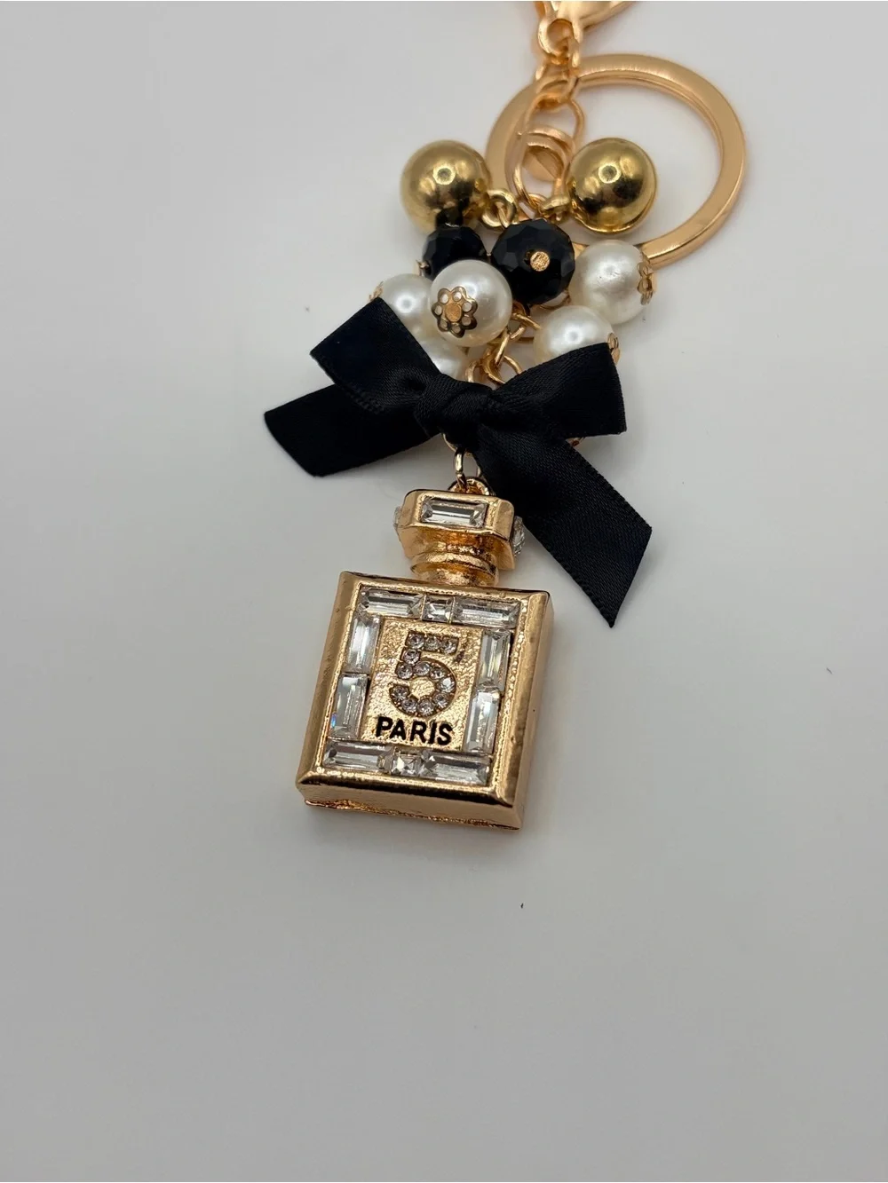 Gold Perfume Bottle Keychain with Black Bow and Pearls